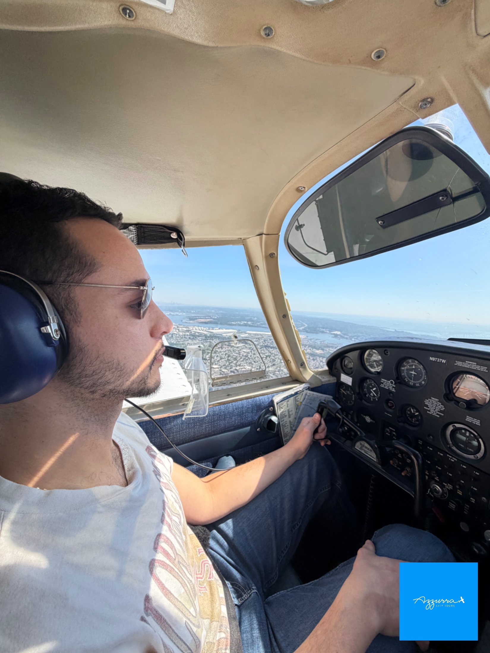 View of the Manhattan skyline through the window of a Piper Cherokee during Matthew V.'s discovery flight from Linden Airport
